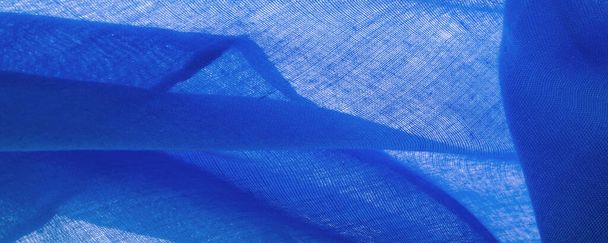 Υφή. Ύφασμα φόντου από μετάξι μπλε ματ χρώμα, (χρώμα ή επιφάνεια) είναι θαμπό και επίπεδο, χωρίς λάμψη. - Φωτογραφία, εικόνα