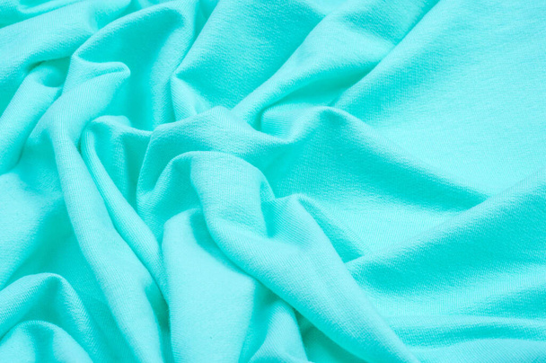 Texture, fond, motif. Le tissu est tricoté en bleu, turquoise, bleu. J'ajouterai une approche créative à votre prochain projet. Avec ce tissu, vous serez la première couleur douce dont vous avez besoin - Photo, image