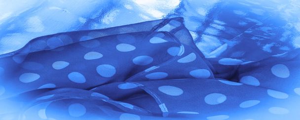 Background texture, decorative ornament, blue polka-dot silk fabric, round dots on fabric that have a shape or approximately resemble a circle or cylinder. - Photo, Image