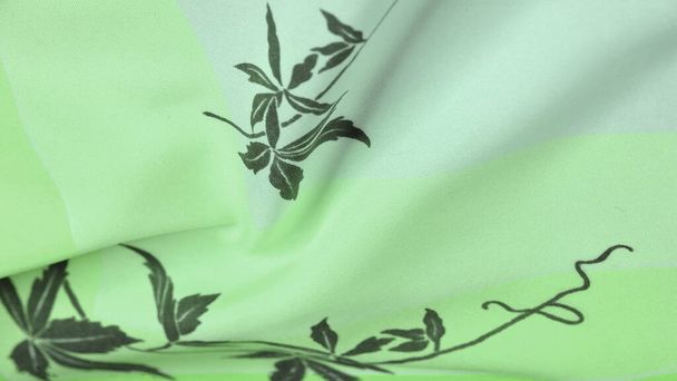 Textuur, achtergrond, patroon, ansichtkaart, zijde stof, groene celadon klaver tinten, zwarte patronen met print, bloemenpatroon, prachtige stof zal uw project de beste maken - Foto, afbeelding