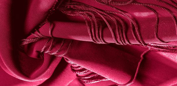 Background texture of silk fabric. This is a natural red scarf, this beautiful nylon satin made of artificial silk with a transparent hand and a wonderful sheen is perfect for your projects. - Photo, Image