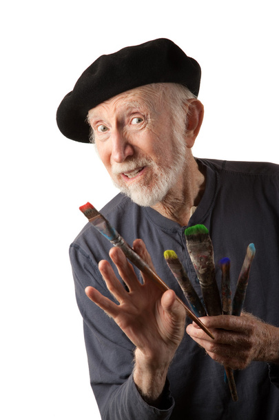 Senior artist with beret and brushes - Photo, image