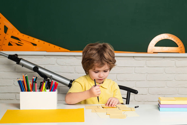 Portrait of Pupil in classroom. Elementary school and education. Individual tutoring. - Фото, зображення