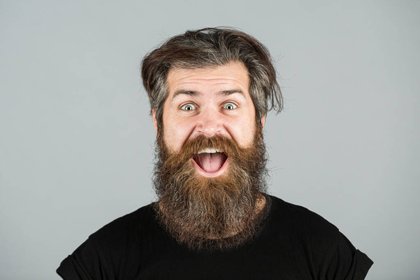 Happy man smile face. Handsome smiling young guy with long beard and moustache. Bearded man. Positive human facial expressions and emotions. - 写真・画像