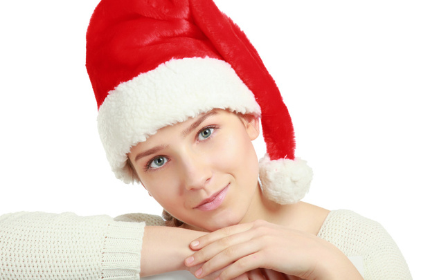 Portrait of a beautiful woman wearing a santa hat - Foto, Imagen
