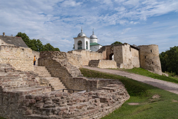 A view of the old Izborsk fortress, Nikolsky's defense sleeve, gates and St. Nicholas Cathedral of 14th century behind the fortified walls. Pskov region, Russia. - Photo, Image