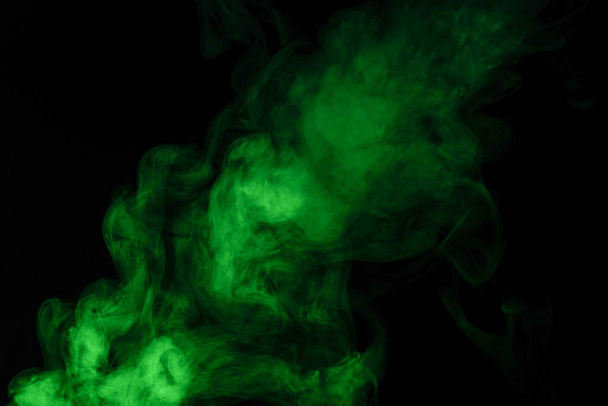 Green steam on a black background. Copy space. - Фото, зображення