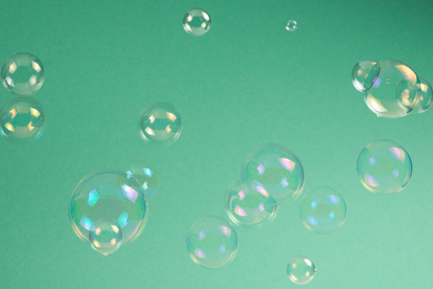 Soap bubbles isolated on a black background. Copy space.  - Photo, Image