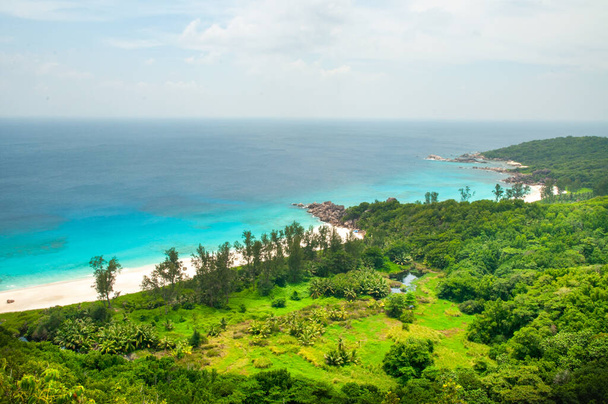 Elevated view of the La Digue Island coastline withe the bay in front of Petite Anse. Seychelles - Photo, Image