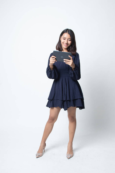 Young Asian woman with a computer tablet on white background - Photo, image