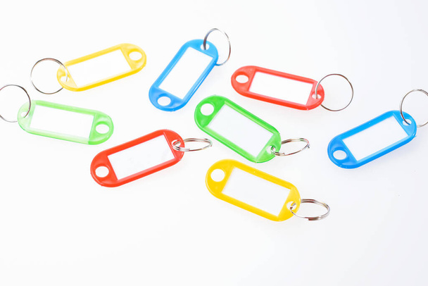 Blank colorful keychains with ring for key. Isolated on white - Foto, Imagen