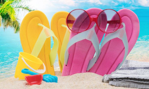 sandals with sunglasses on the beach - Foto, afbeelding