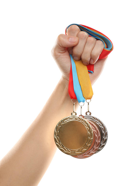 Woman holding medals on white background, closeup. Space for design - Foto, immagini