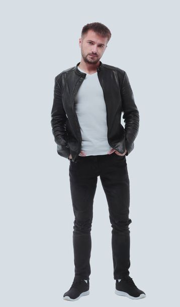 in full growth. stylish young man in black leather jacket - Фото, зображення