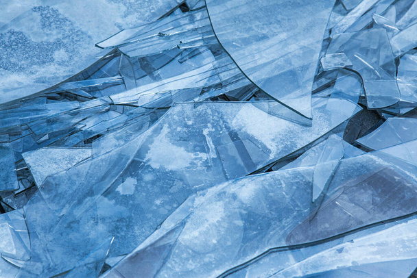 Background of broken glass on the floor in blue tones. - Photo, Image