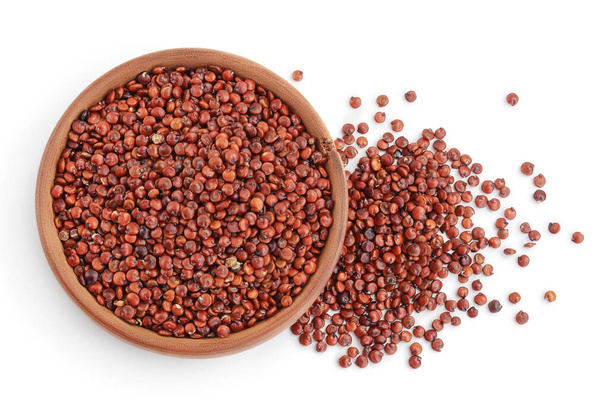 red quinoa seeds in wooden bowl isolated on white background with clipping path and full depth of field. Top view. Flat lay - Foto, afbeelding