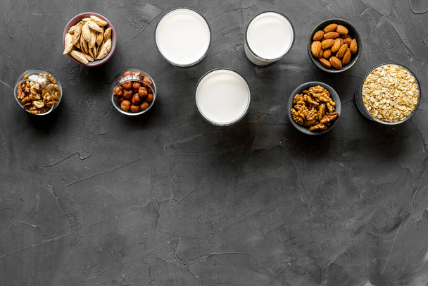 Set of non-dairy milk - almond hazelnut walnut oat. Top view, copy space - Foto, imagen