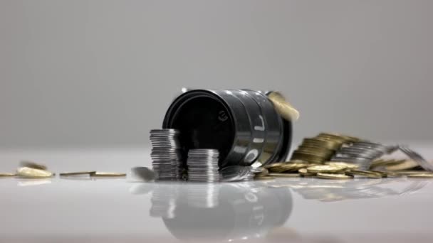 Oil barrels and coins money on gray background. - Footage, Video