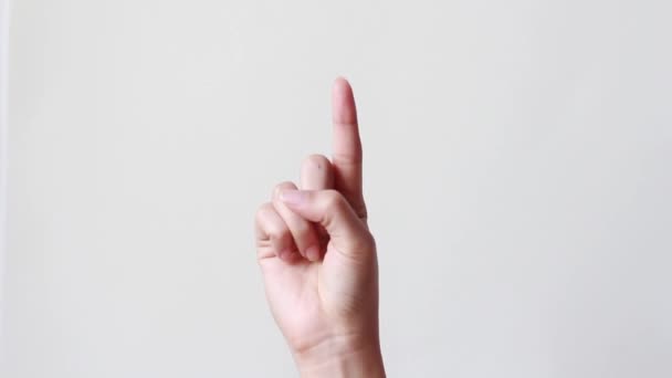 female hand index finger pointing up on white background.copy space. - Footage, Video