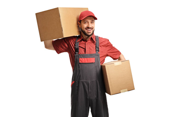 Male worker holding two cardboard boxes isolated on white background - Foto, Imagem