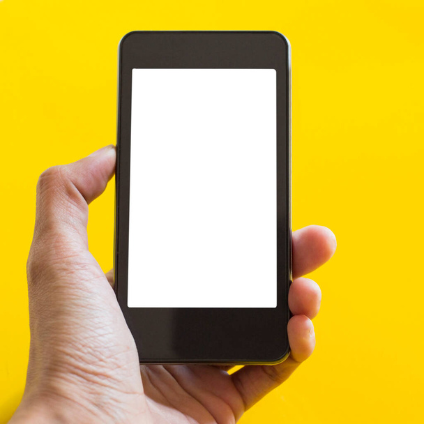 Χέρι αφής κινητό χώρο λευκό κίτρινο φόντο - Φωτογραφία, εικόνα