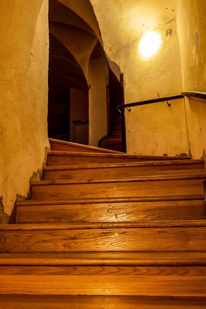 Narrow vintage staircase in an old castle - Foto, imagen
