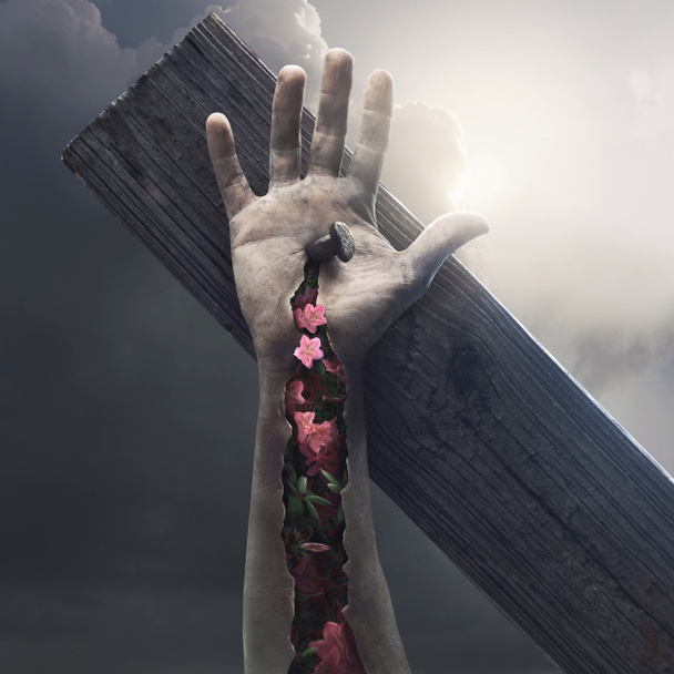 Çarmıhtaki İsa 'nın gerçek üstü görüntüsü. Çiçekler ve hayat deriyi delip geçiyor. - Fotoğraf, Görsel