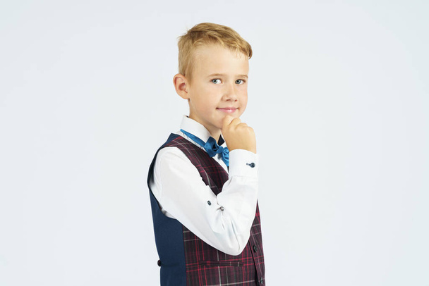 Portrait of a schoolboy looking at the camera. Isolated background. Education concept. - Photo, image