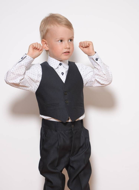 Little fashionable boy posing on white background - Fotografie, Obrázek