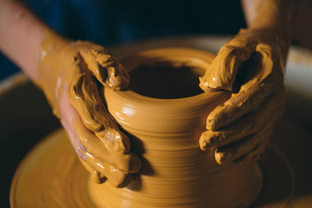 Pottery workshop. A little girl makes a vase of clay. Clay modeling - Zdjęcie, obraz