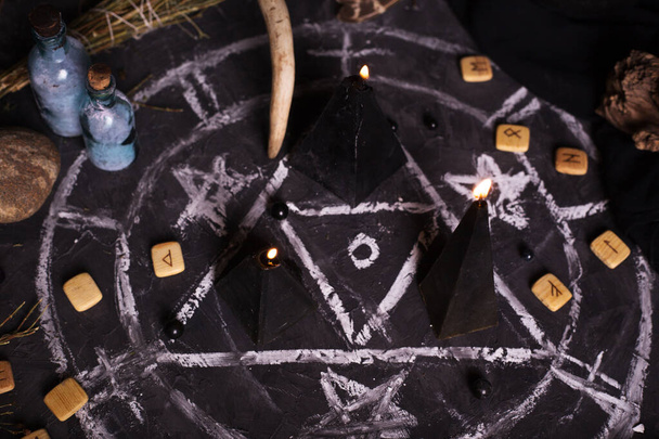 Still life with burning candles and pentagram circle background. Black magic ritual with occult, evil and esoteric symbols. Halloween or divination rite - Φωτογραφία, εικόνα