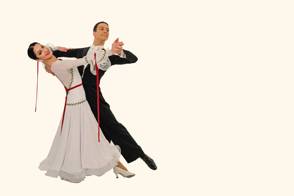 ballrom dance couple in a dance pose isolated on white bachground - 写真・画像
