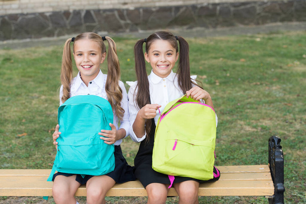 Cute classmates girls with backpacks, back to school concept - Фото, изображение