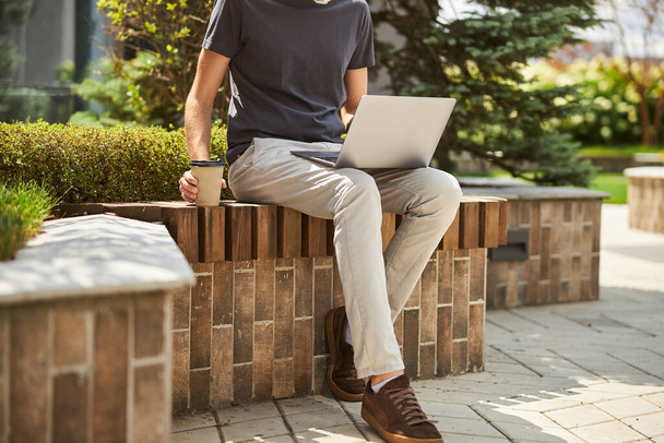 Caucasian male freelancer working on his laptop - Фото, изображение