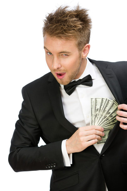 Businessman hiding cash - Foto, afbeelding
