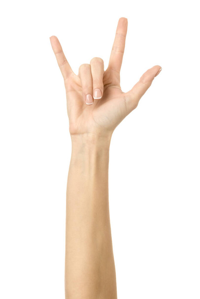 Rock and roll. Woman hand with french manicure gesturing isolated on white background. Part of series - Photo, Image