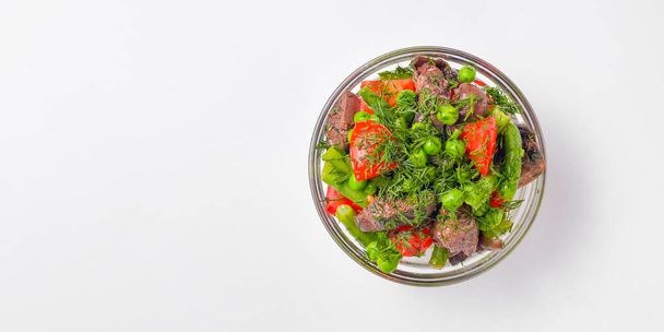 Healthy food - mix vegetable salad served in a bowl over white background. Healthy eating, delicious snack or dinner. Banner with copy space. - Foto, immagini