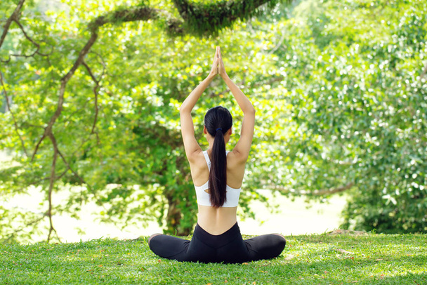 calmness and relax.healthy woman yoga lifestyle balanced practicing meditation and zen energy exercise sport yoga outdoors. Healthy life Concept. - 写真・画像