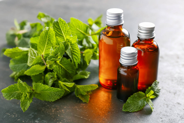 Mint essential oil on table - Photo, Image