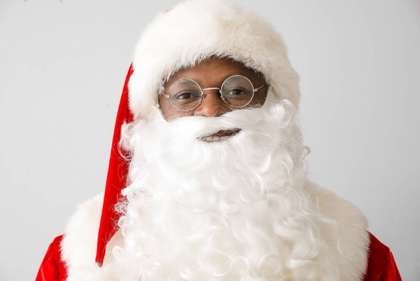 African-American Santa Claus on light background - Foto, Imagem