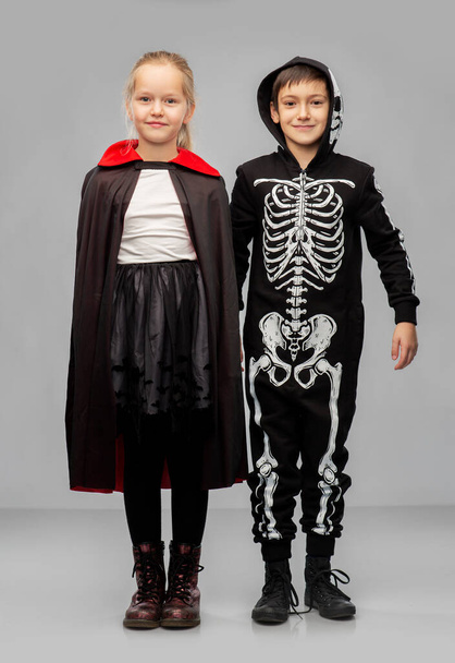 happy children in halloween costumes - Фото, изображение