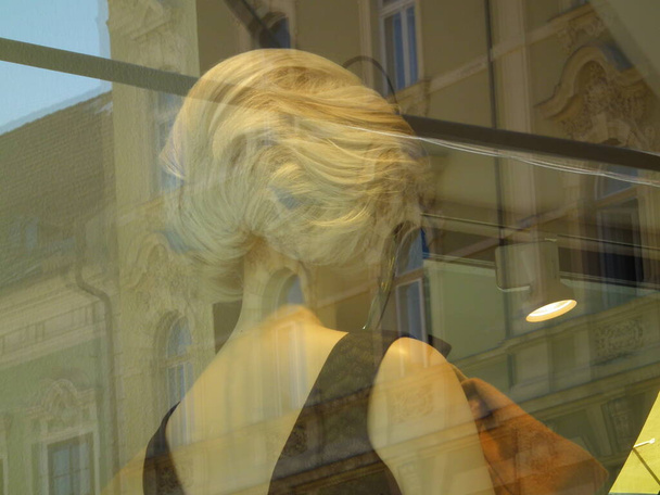 Mannequins in a show case on day light. Sale. - Fotó, kép