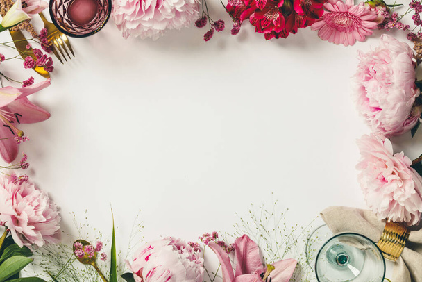 Cultery, glasses and flowers - Spring and festive table setting concept - 写真・画像