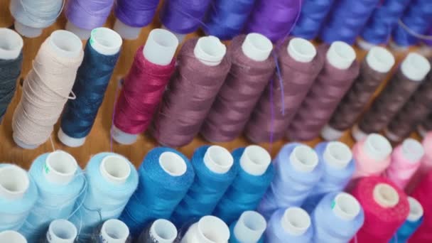 Footage of colourful spools of threads in workshop - Footage, Video