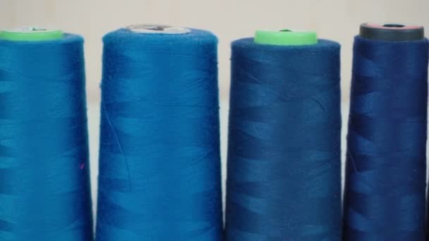 Video of blue spools of threads in workshop - Footage, Video