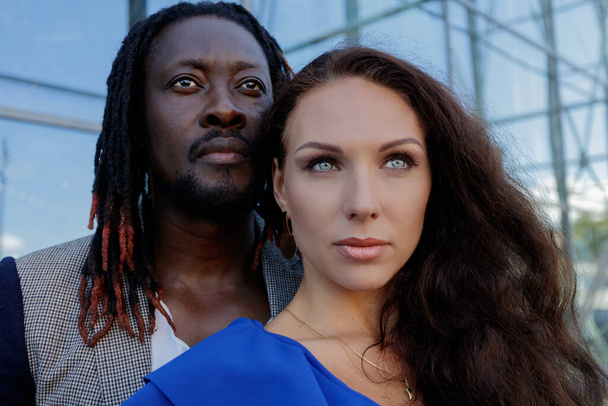 Close-up portrait, outdoors. mixed couple, African and European Caucasian. - Photo, Image