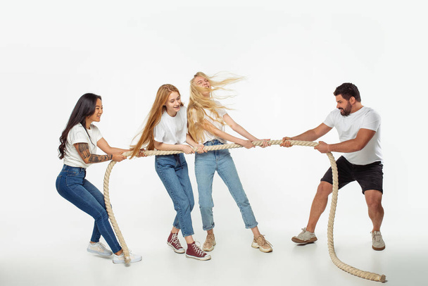 Group of adorable multiethnic friends having fun isolated over white studio background - Photo, Image