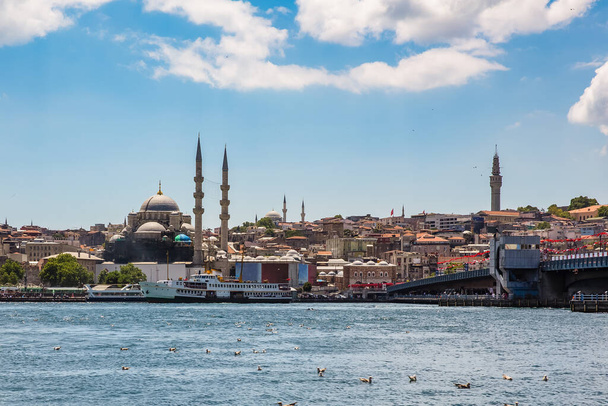 The old town of Istanbul showing the Golden Horn Bridge (Halic koprusu), The Yeni Mosque, Spice (Egyptian) Bazaar, The Beyazit Tower, ferries and boats on the Golden Horn, Turkey - Photo, Image