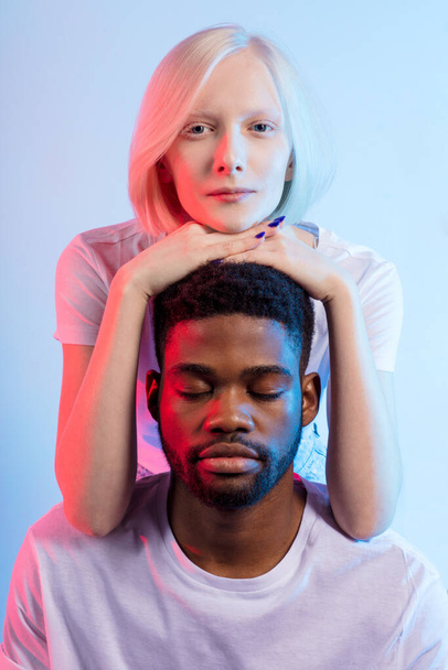 awesome young interracial couple doing yoga, - 写真・画像