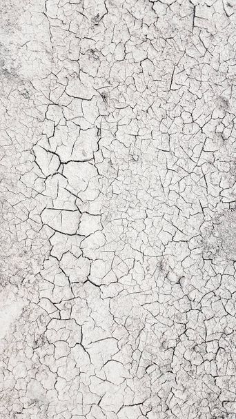Kuru çamur, zemini çatlatmış. Kuraklık sezonu geçmişi - Fotoğraf, Görsel